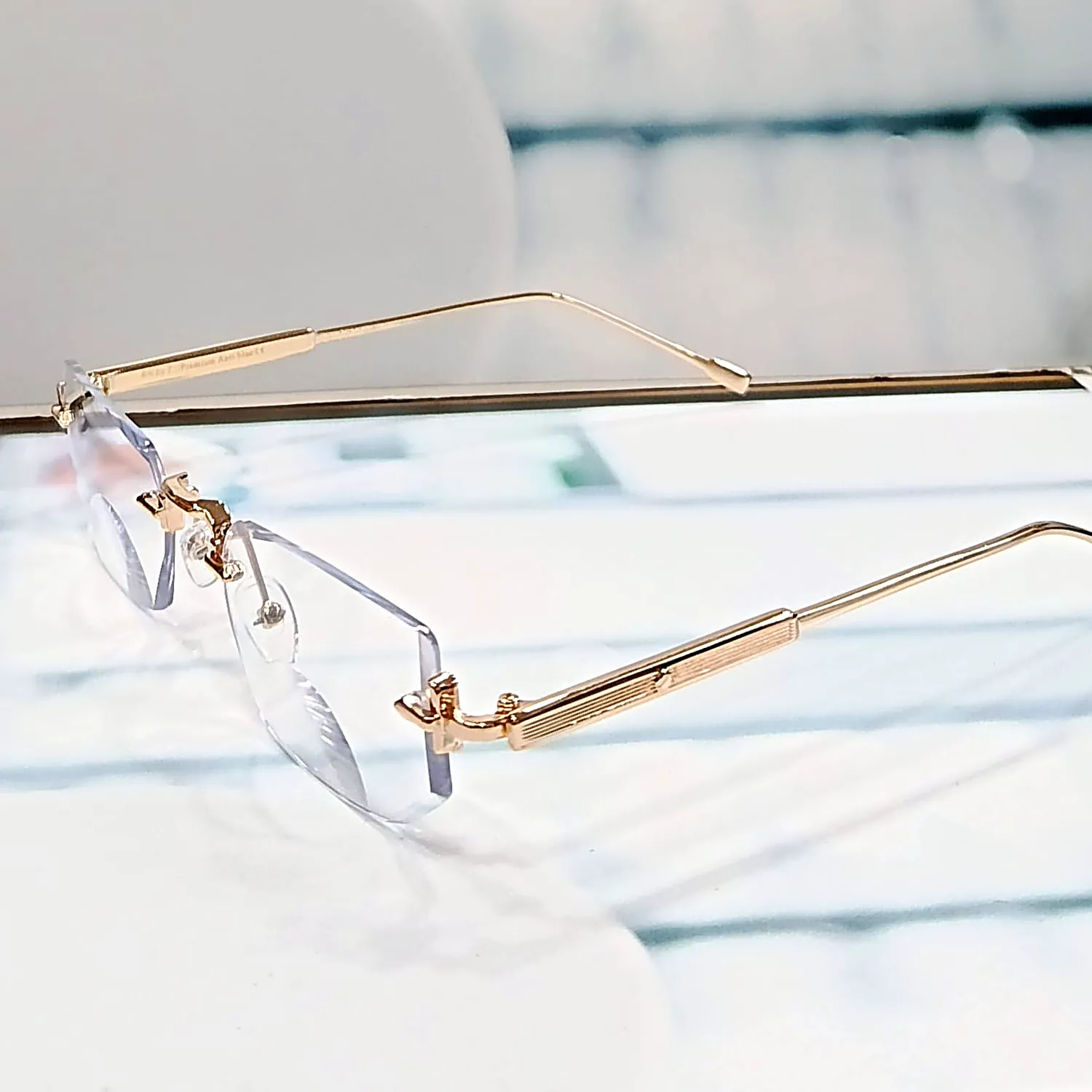 nine optic n102 elite gold rimless front.webp nine optic n102 elite gold rimless front.webp